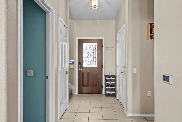 a view of a hallway view with wooden floor and closet