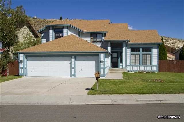 1520 Rainbow Ridge Road Reno, NV 89523 - Photo 1 of 1 a front view of a house with a garden and yard