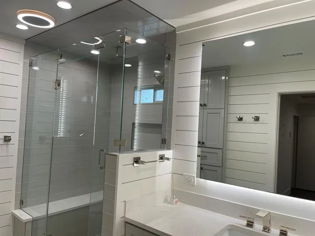 a bathroom with a bathtub and a shower