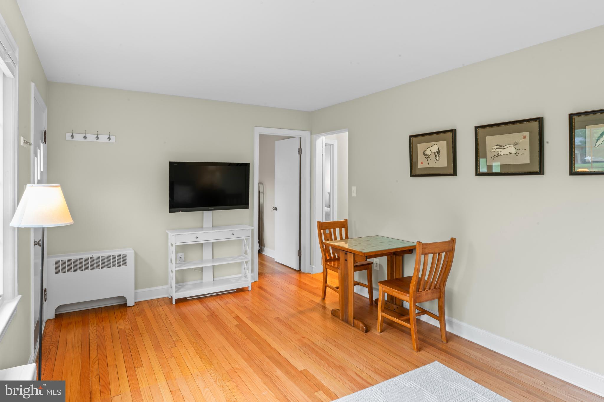 12131 Waples Mill Road Oakton, VA 22124 - Photo 4 of 40 a bedroom with furniture and a flat screen tv