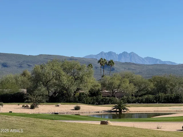 a kitchen with stainless steel appliances granite countertop a refrigerator stove and sink