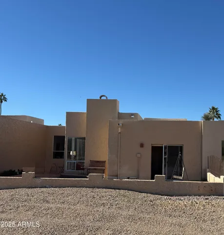 a living room with fireplace furniture and a wooden floor