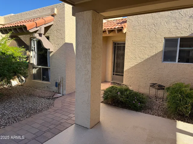 a kitchen with stainless steel appliances granite countertop a refrigerator stove and sink