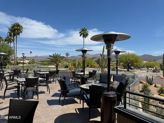 a large living room with furniture and a large window