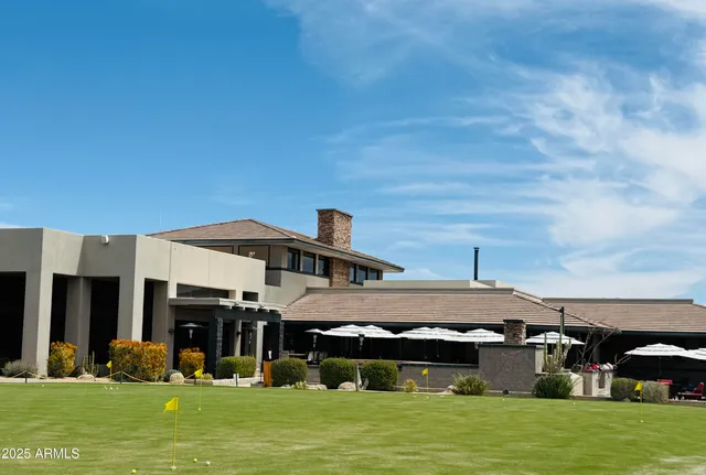 a view of a swimming pool with a yard