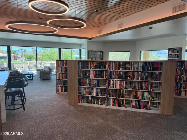 a street sign on a sidewalk next to a road