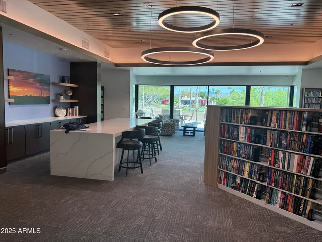 a front view of a house with a tree