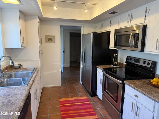 a view of a swimming pool with an ocean view