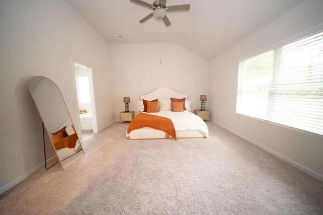 a bed room with a bed and a window