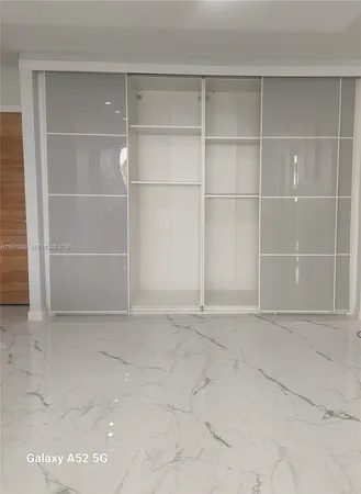 a view of an empty room with empty racks