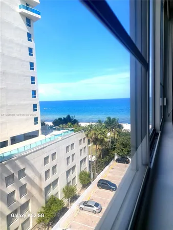 a view of a balcony with an ocean view