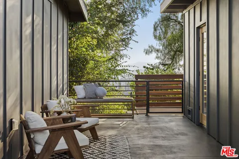 a view of balcony and chairs