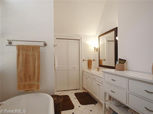 2109 Rolling Road Greensboro, NC 27403 - Photo 11 of 16 Master Bath/Spa. Double vanity, closet and a wall to accommodate a large piece of furniture.