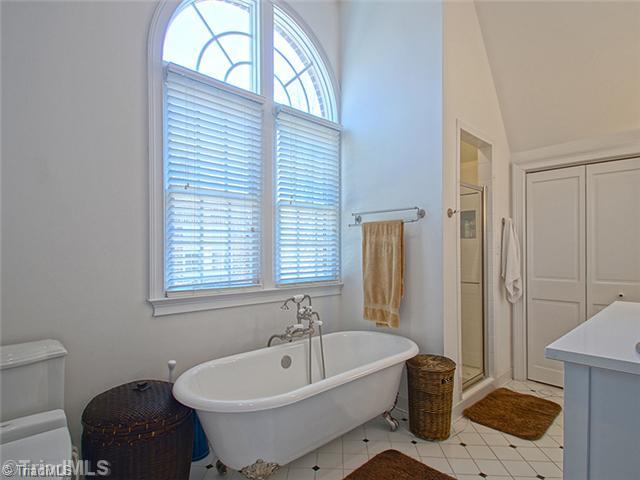 2109 Rolling Road Greensboro, NC 27403 - Photo 10 of 16 Master Bath/Spa. Long soaking tub to relax in after a hard day. Note the opulent claw feet on the tub and the separate shower.