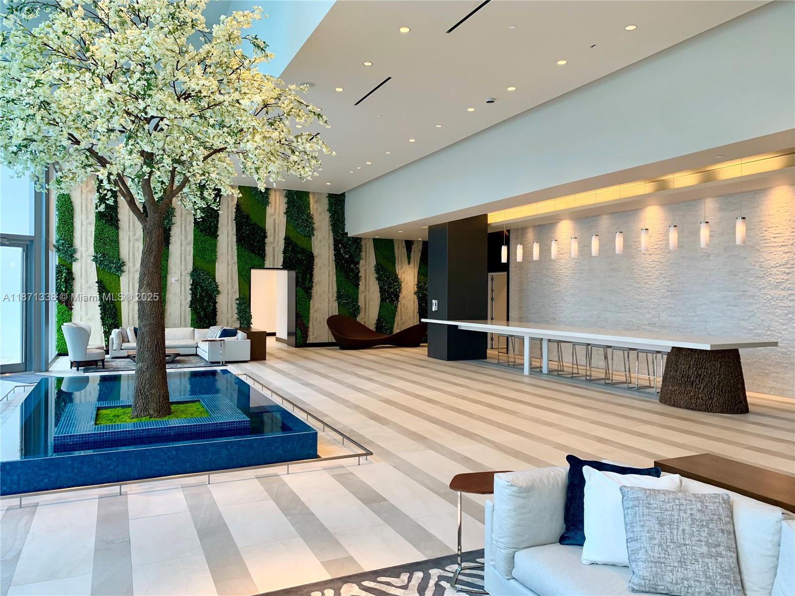 851 Northeast 1st Avenue, Unit 502 Miami, FL 33132 - Photo 23 of 48 a living room with large windows and furniture