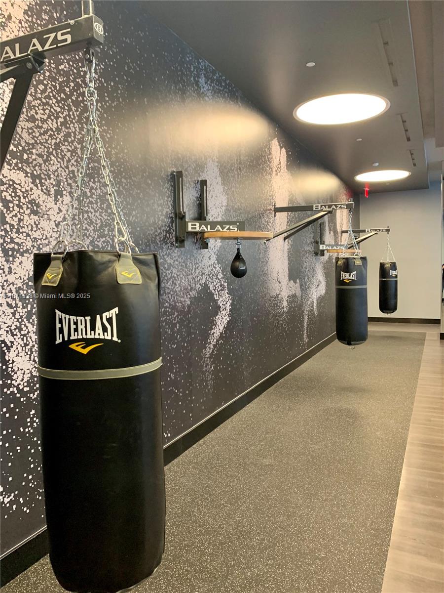 851 Northeast 1st Avenue, Unit 502 Miami, FL 33132 - Photo 30 of 48 a view of a refrigerator in kitchen and an empty room