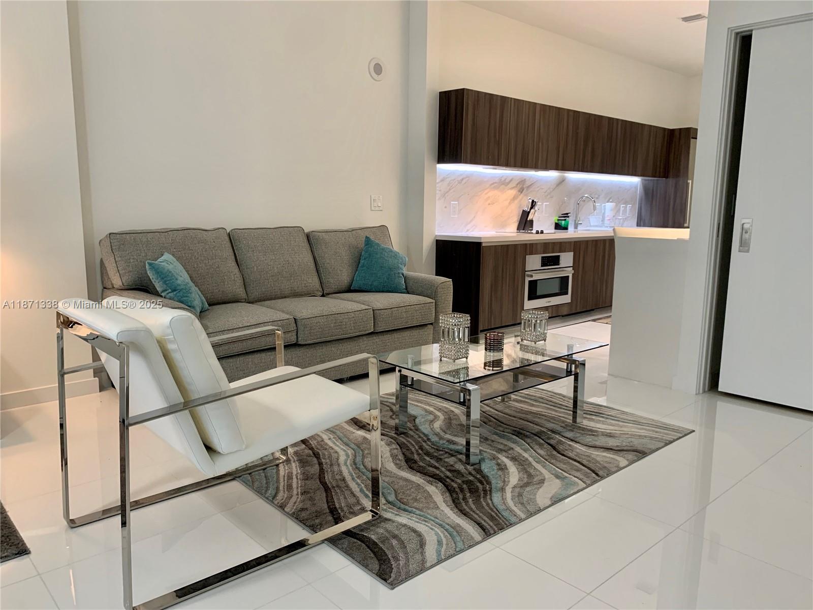 851 Northeast 1st Avenue, Unit 502 Miami, FL 33132 - Photo 3 of 48 a living room with furniture