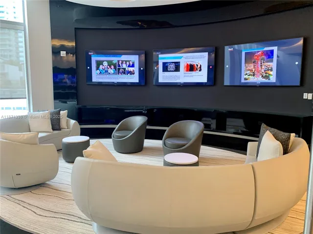 a room with pool table and flat screen tv