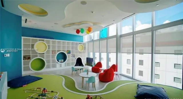 a swimming pool with outdoor seating