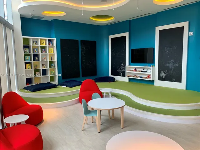 a living room with furniture window and flat screen tv