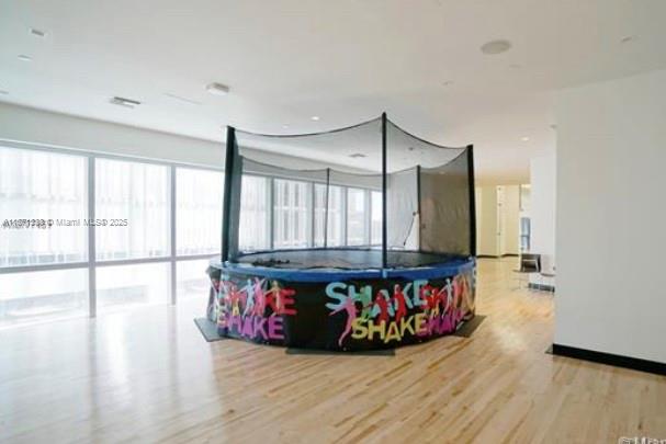 851 Northeast 1st Avenue, Unit 502 Miami, FL 33132 - Photo 35 of 48 a living room with furniture window and flat screen tv