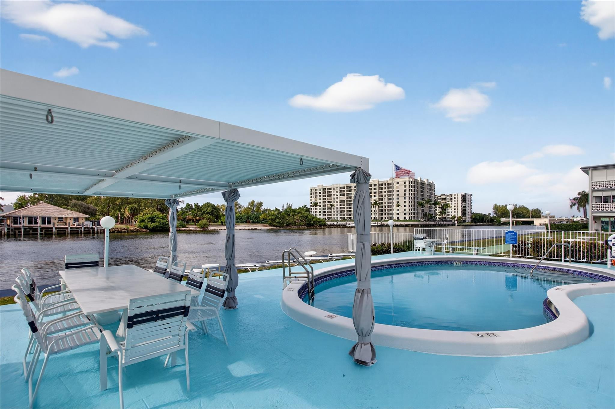 1001 North Riverside Drive, Unit 305 Pompano Beach, FL 33062 - Photo 30 of 44 a view of a swimming pool with a patio
