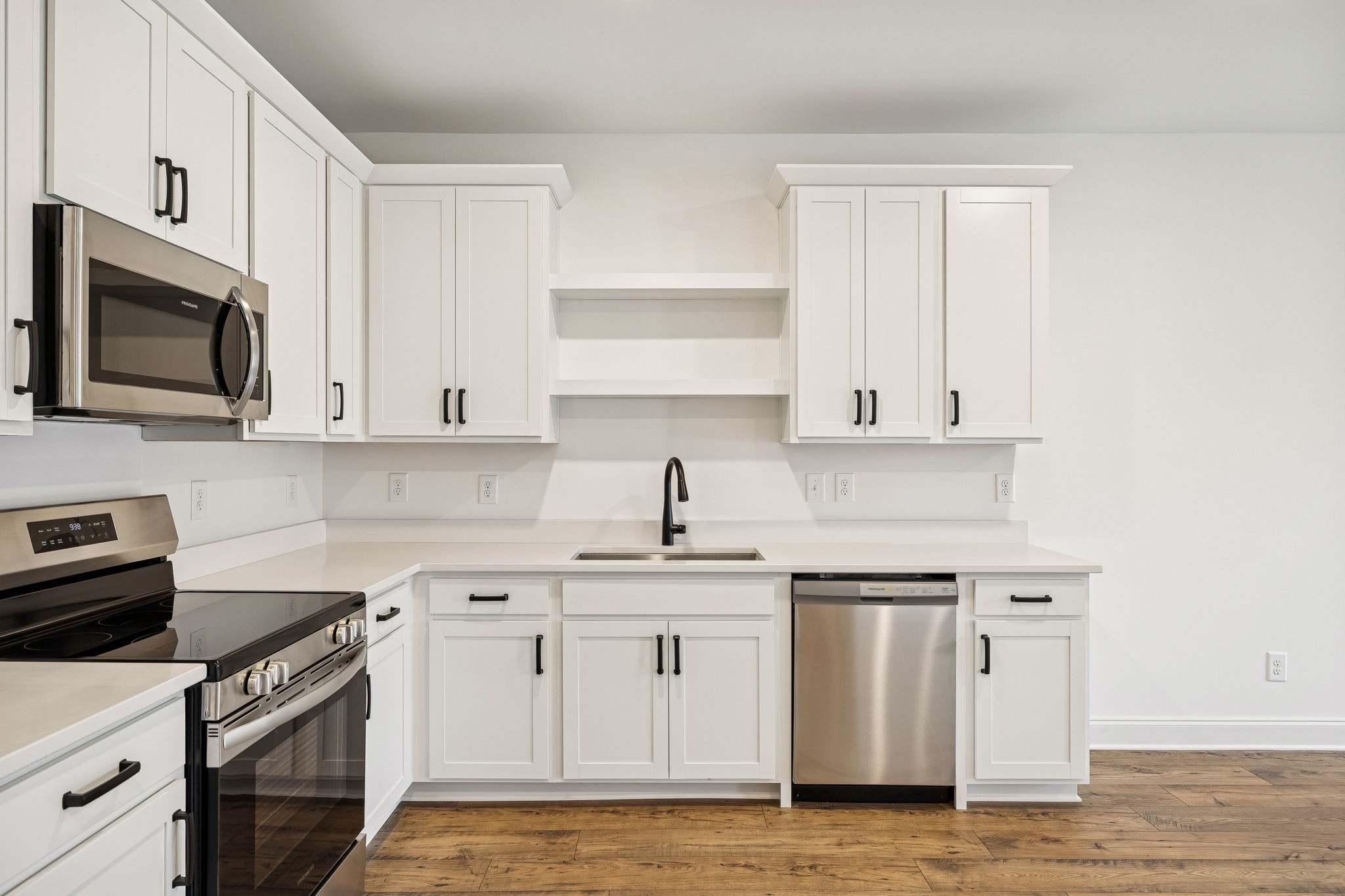 609 South Main Street Mount Pleasant, TN 38474 - Photo 12 of 37 a kitchen with white cabinets stainless steel appliances and sink
