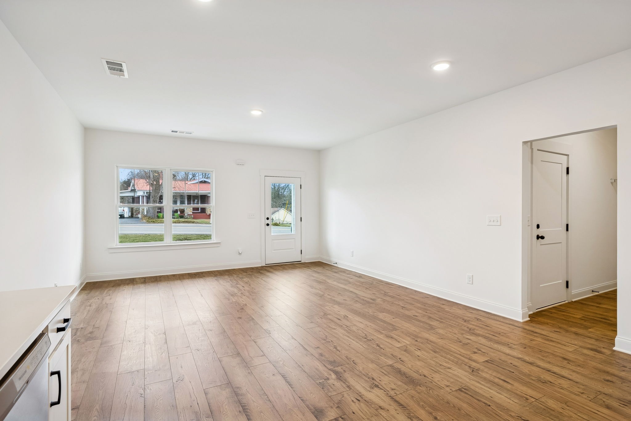 609 South Main Street Mount Pleasant, TN 38474 - Photo 15 of 37 an empty room with wooden floor and windows