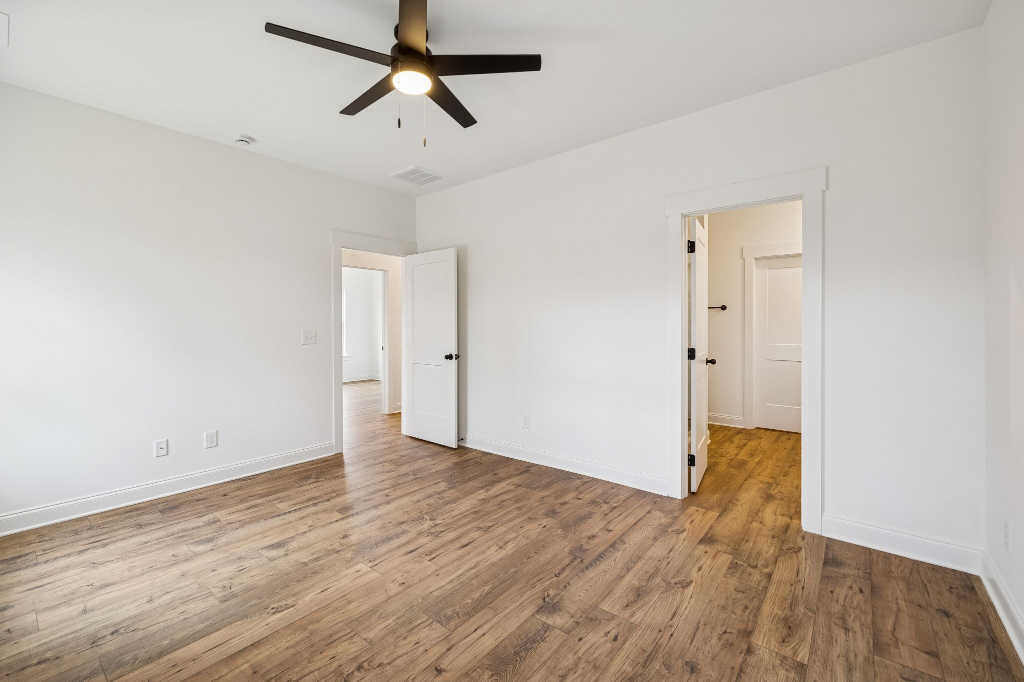 609 South Main Street Mount Pleasant, TN 38474 - Photo 23 of 37 an empty room with wooden floor and windows