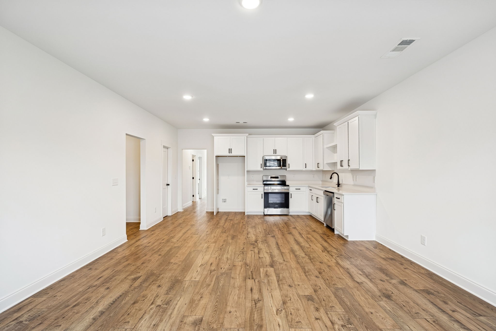 609 South Main Street Mount Pleasant, TN 38474 - Photo 8 of 37 a view of kitchen with wooden floor