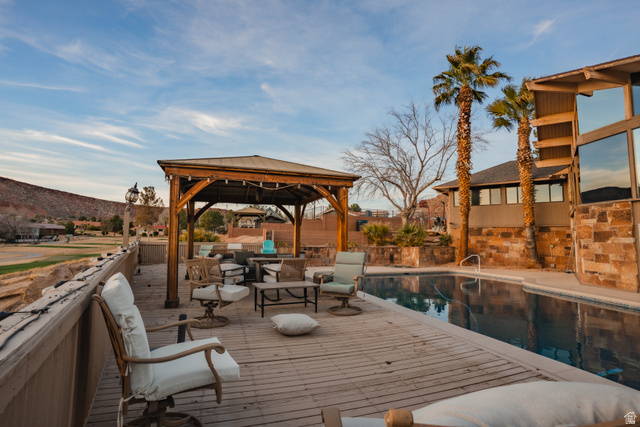 980 Cactus Circle St. George, UT 84790 - Photo 42 of 77 Wooden terrace featuring a gazebo, outdoor furniture, and a mountain view