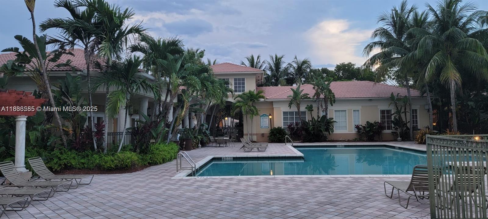 2564 Centergate Drive, Unit 304 Miramar, FL 33025 - Photo 1 of 13 a front view of house with yard and green space