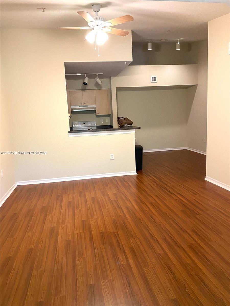 2564 Centergate Drive, Unit 304 Miramar, FL 33025 - Photo 4 of 13 a view of a room with wooden floor
