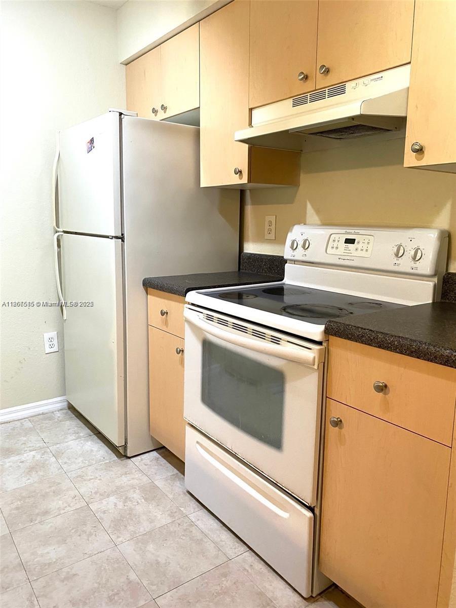 2564 Centergate Drive, Unit 304 Miramar, FL 33025 - Photo 8 of 13 a utility room with dryer and washer