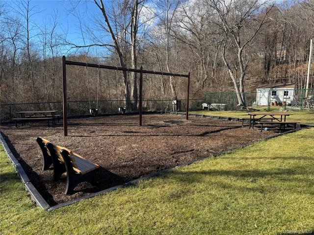 a view of a backyard with sitting area