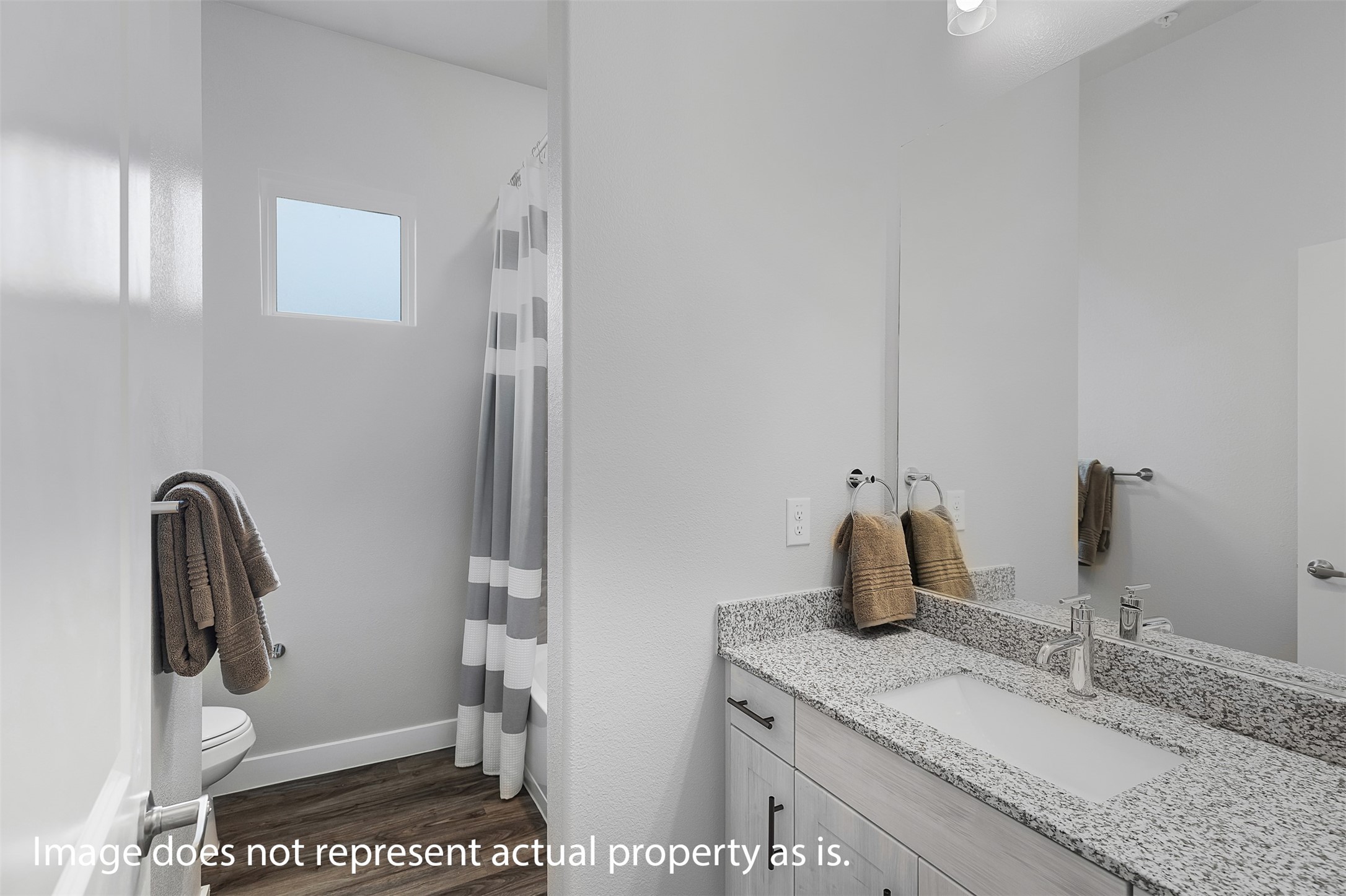 7237 Rustle Road Fort Worth, TX 76123 - Photo 14 of 34 a bathroom with a granite countertop sink a toilet and a mirror