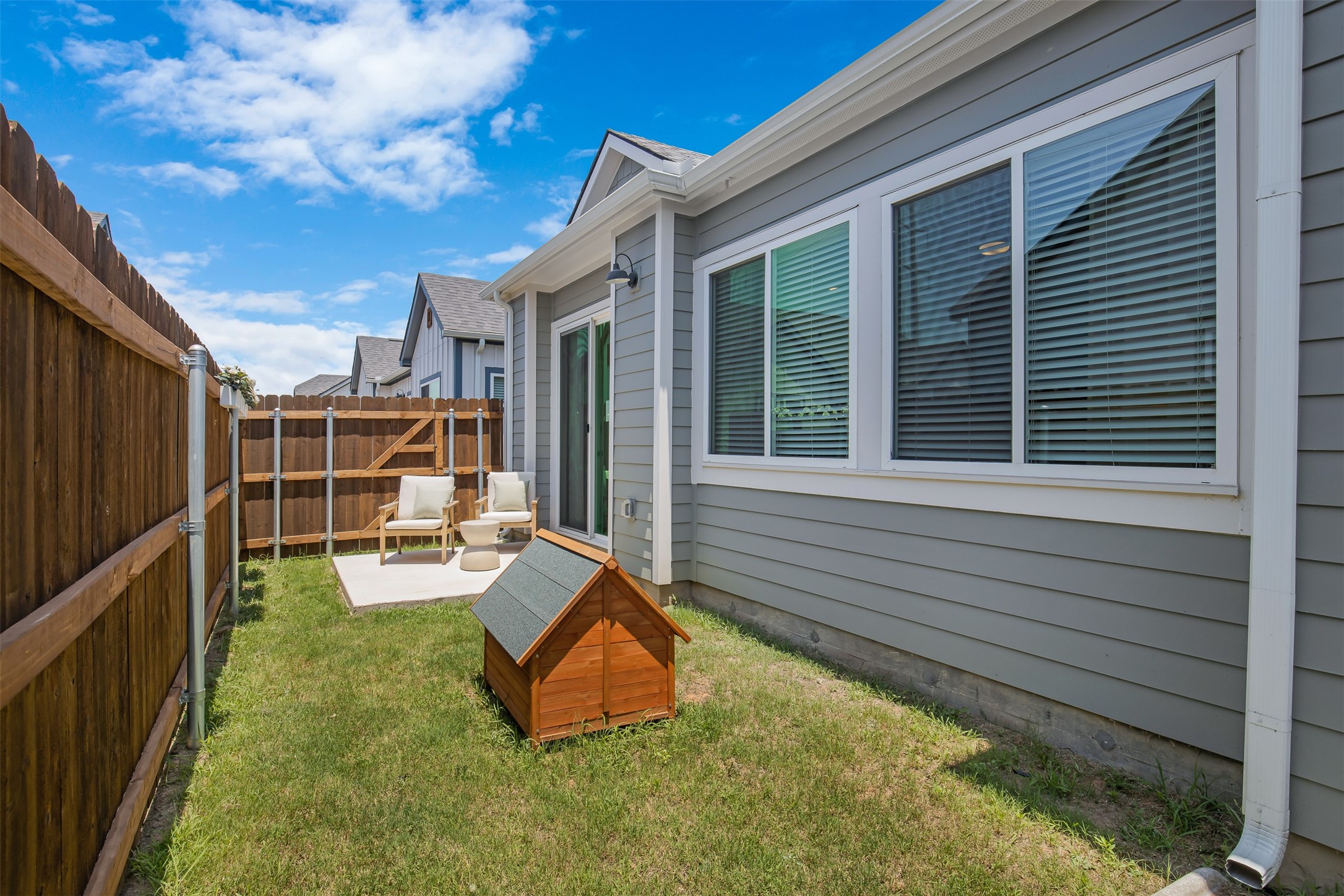 7237 Rustle Road Fort Worth, TX 76123 - Photo 20 of 34 a view of a backyard with chairs and a small yard