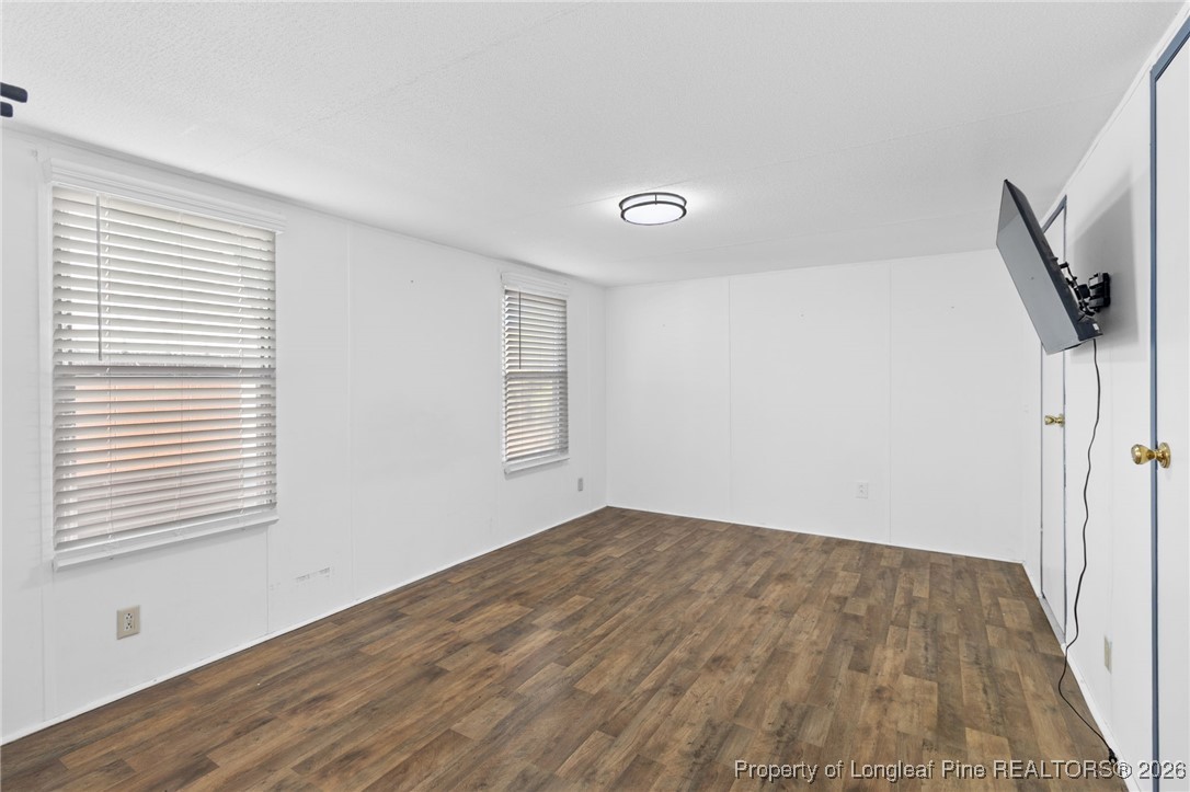 7321 Sheriff Watson Road Sanford, NC 27332 - Photo 14 of 26 a view of empty room with wooden floor and fan