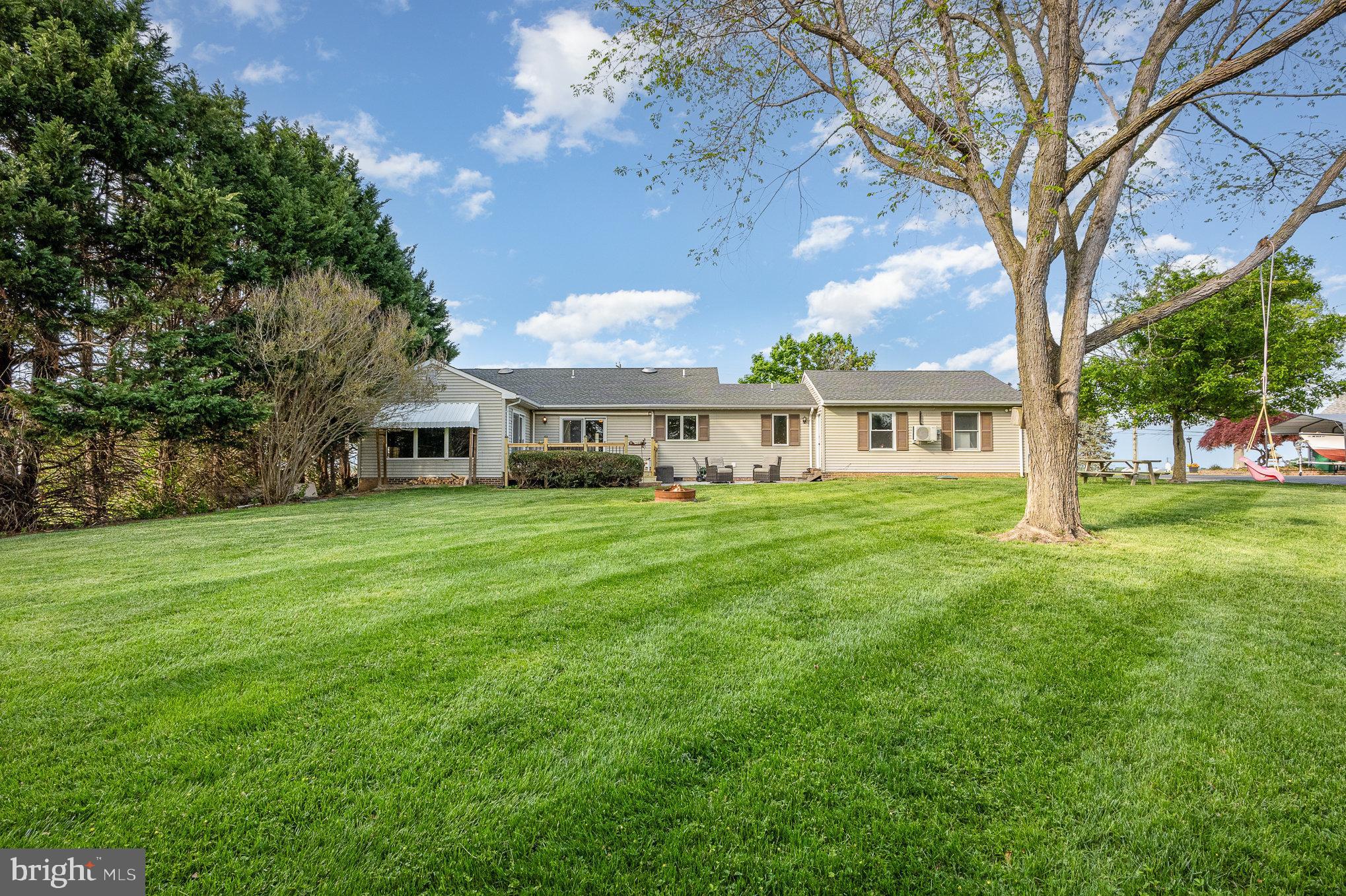 705 Knights Corner Road Elkton, MD 21921 - Photo 30 of 35 a front view of a house with yard and green space