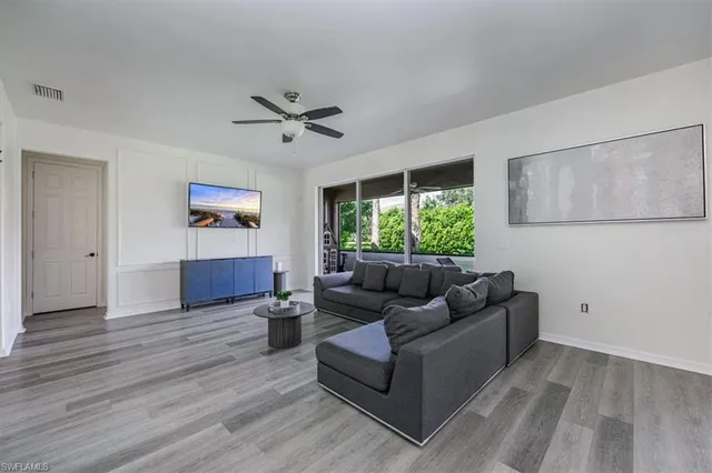 a living room with furniture and a window