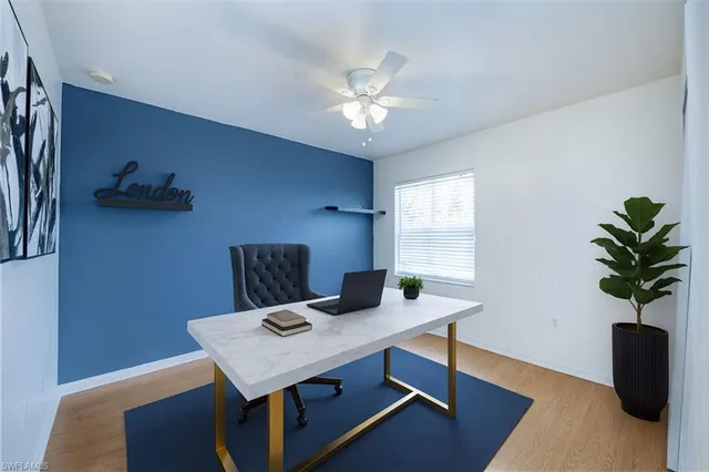 a view of a workspace with furniture