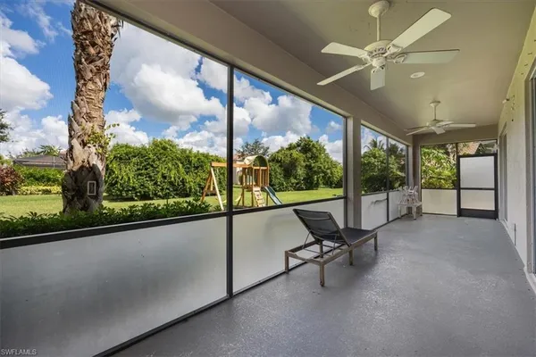 a view of a room with porch and wooden floor