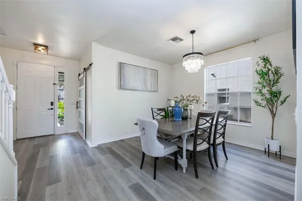 a kitchen with stainless steel appliances a sink stove and cabinets