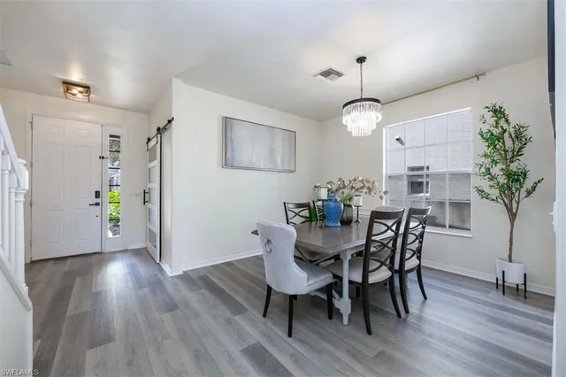 a kitchen with stainless steel appliances a sink stove and cabinets