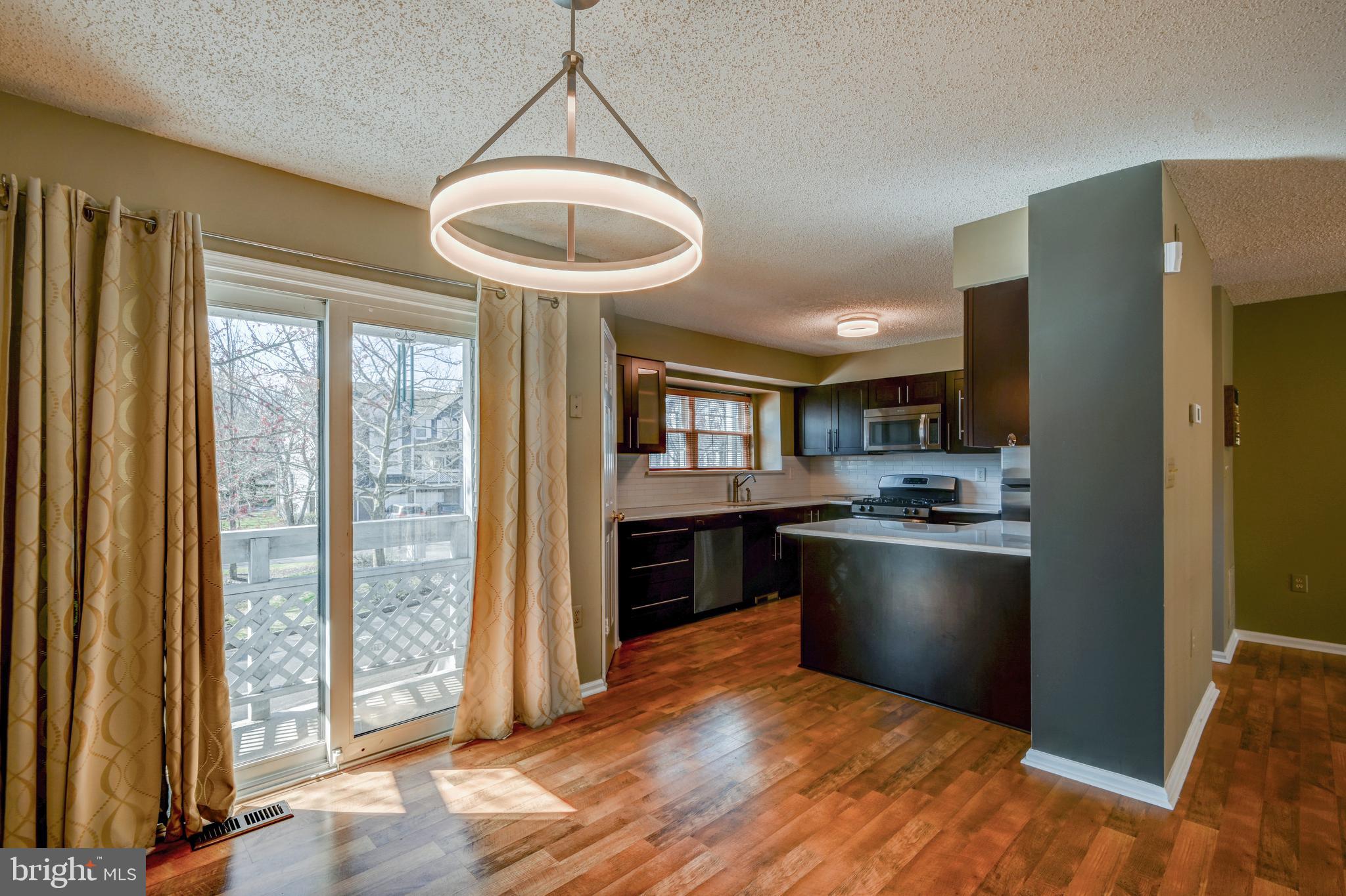 12 Halstead Place Princeton, NJ 08540 - Photo 16 of 25 Kitchen with Sliding Room to Balcony