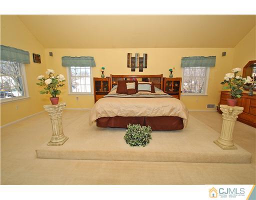 35 Finley Road Edison, NJ 08817 - Photo 14 of 25 a living room with furniture and a flat screen tv