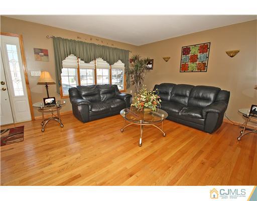 35 Finley Road Edison, NJ 08817 - Photo 3 of 25 a living room with furniture and a large window