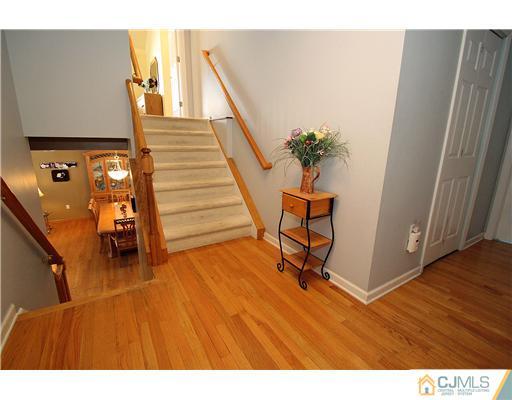 35 Finley Road Edison, NJ 08817 - Photo 22 of 25 a view of a hallway with wooden floor and stairs