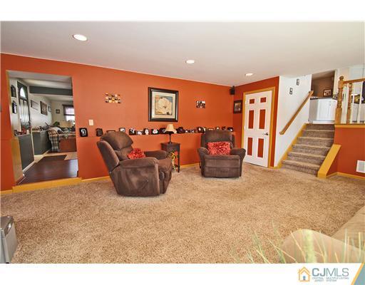 35 Finley Road Edison, NJ 08817 - Photo 8 of 25 a living room with furniture and a flat screen tv