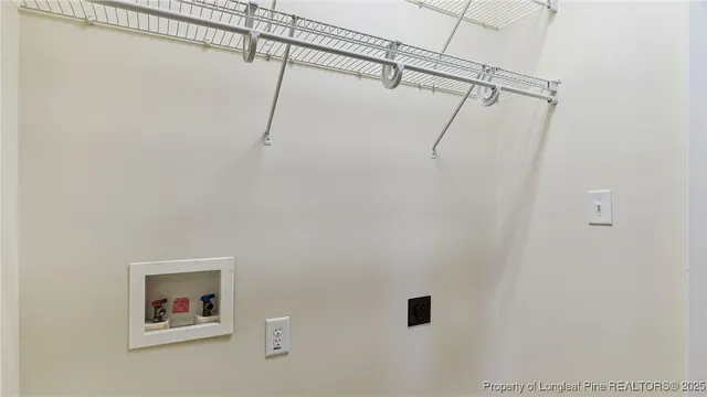 a view of balcony with wooden floor and fence